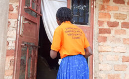 A YBU Social Worker enters a family home on the return of the discharged person
