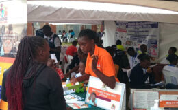 A YBU Social worker speaks to a community member during the Mnetal Health day celebrations