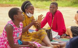 A YouBelong Staff leads a discussion on mental health with children at the session